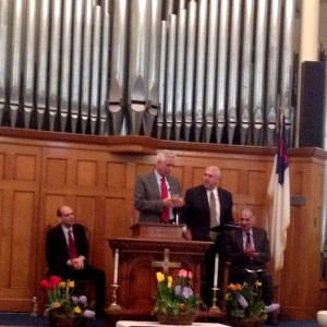 Jan Schlictmann speaks. (at left is Mitchell Garabedean, right is Richard Newman and Ralph Nader)